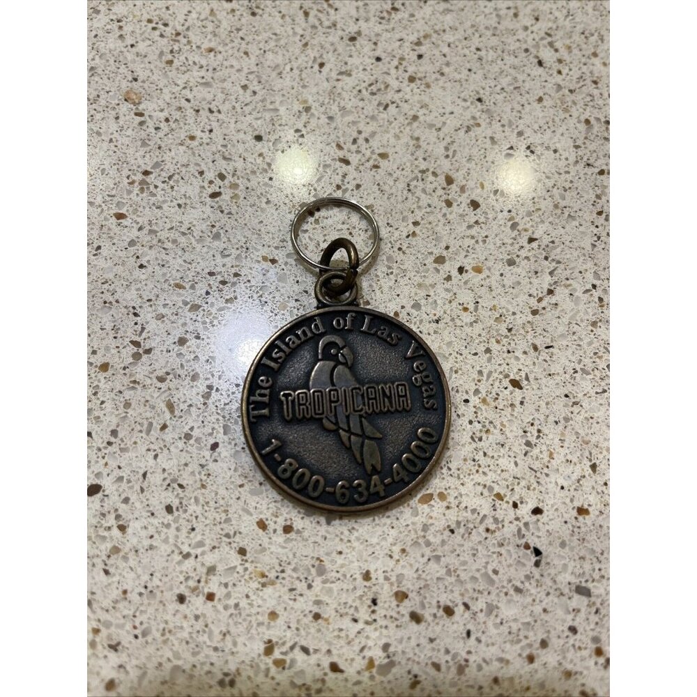 The Island of Las Vegas Tropicana Nevada Casino Bronze Colored Keychain